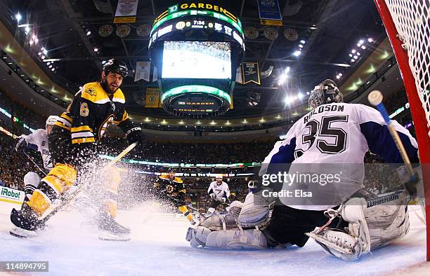 Nathan Horton of the Boston Bruins shoots his game winning third period goal past Dwayne Roloson of the Tampa Bay Lightning in Game Seven of the...