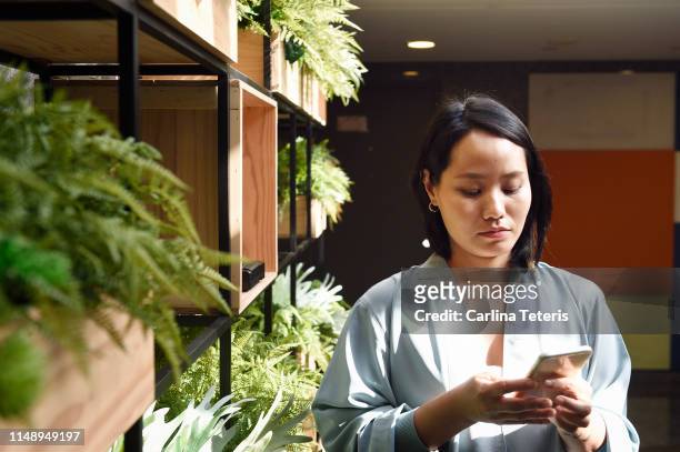 Young Chinese woman using a smart phone