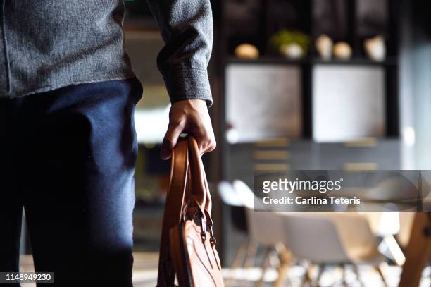 man's body walking through an office - arrival stock pictures, royalty-free photos & images