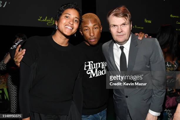 Helen Lasichanh, Pharrell Williams, and Rob Stringer attend the Robin Hood Benefit 2019 at Jacob Javitz Center on May 13, 2019 in New York City.