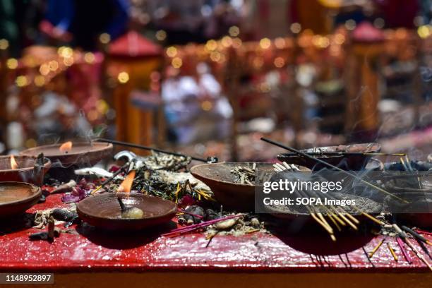 Oil lamps and Incense burn during the annual Hindu festival in Ganderbal district, about 30kms northeast of Srinagar, Kashmir. Thousands of Kashmiri...