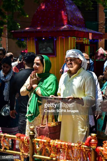 Devotees pray at the Kheer Bhawani temple during the annual Hindu festival in Ganderbal district, about 30kms northeast of Srinagar, Kashmir....