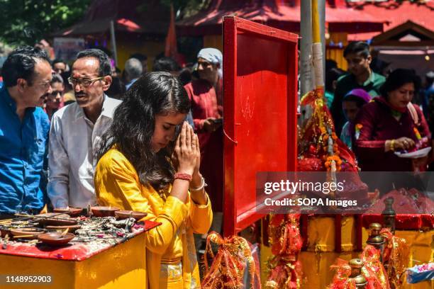 Devotee prays at the Kheer Bhawani temple during the annual Hindu festival in Ganderbal district, about 30kms northeast of Srinagar, Kashmir....