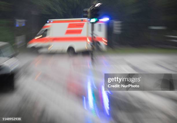 Ambulance with flashing blue light, on June 10 in Munich, Germany. .