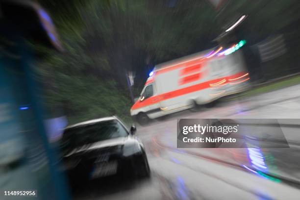 Ambulance with flashing blue light, on June 10 in Munich, Germany. .