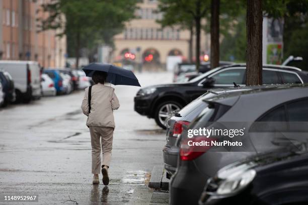 Woman with an umbrella, on June 10 in Munich, Germany. .