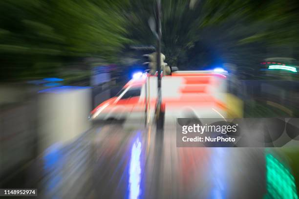 Ambulance with flashing blue light, on June 10 in Munich, Germany. .