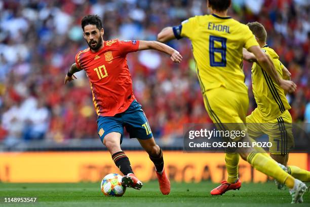 Spain's midfielder Isco vies with Sweden's midfielder Albin Ekdal during the UEFA Euro 2020 group F qualifying football match between Spain and...