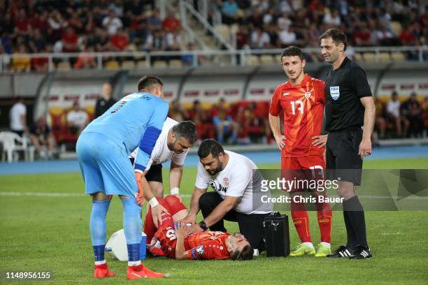 June 10: Egzon Bejtulai, Enis Bardi of North Macedonia and referee Aleksei Eskov during the UEFA Euro 2020 qualifier match between North Macedonia...