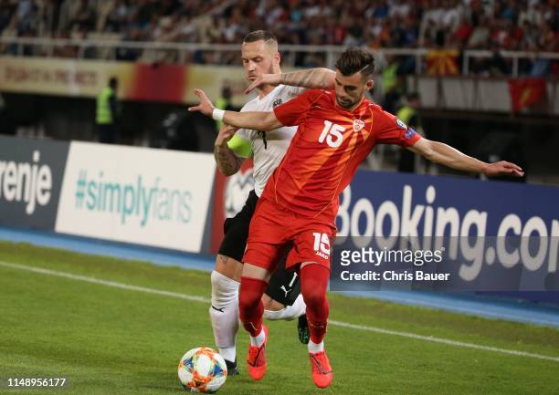 June 10: Marko Arnautovic of Austria and Egzon Bejtulai of North Macedonia during the UEFA Euro 2020 qualifier match between North Macedonia and...
