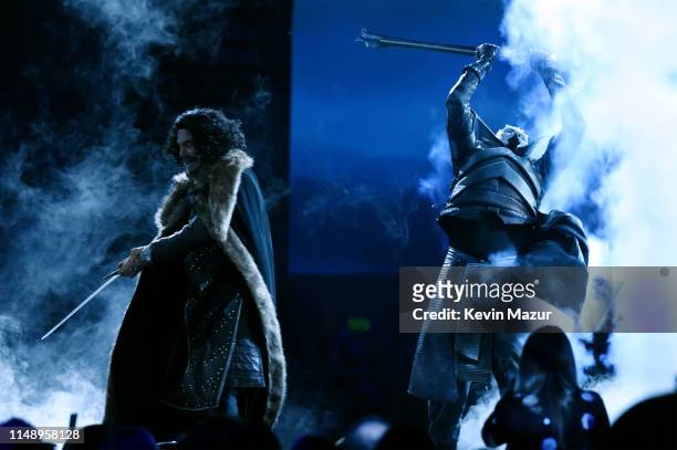 Paul Tudor Jones , dressed as Jon Snow from Game of Thrones, fights the Night King onstage during the Robin Hood Benefit 2019 at Jacob Javitz Center...