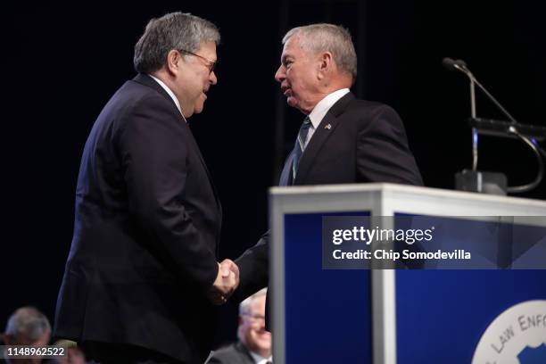 Attorney General William Barr is welcomed to the lectern by former Attorney General John Ashcroft during the National Police Week 31st Annual...