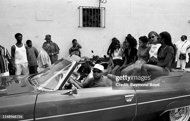 Rapper Brother Marquis from 2 Live Crew gets ready for a 'driving scene' while on the set of their video 'Shake A Lil Somethin'' in Liberty City in...