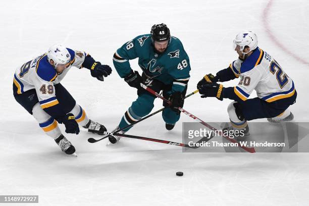 Tomas Hertl of the San Jose Sharks skates with the puck against Ivan Barbashev and Alexander Steen of the St. Louis Blues in Game Two of the Western...