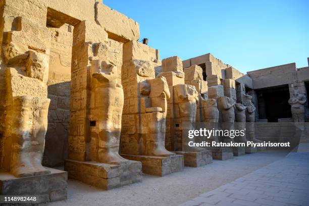 ancient ruins of karnak temple in egypt,"r"nthe karnak temple complex, commonly known as karnak , comprises a vast mix of decayed temples, chapels, pylons, and other buildings near luxor - cairo nile stock pictures, royalty-free photos & images