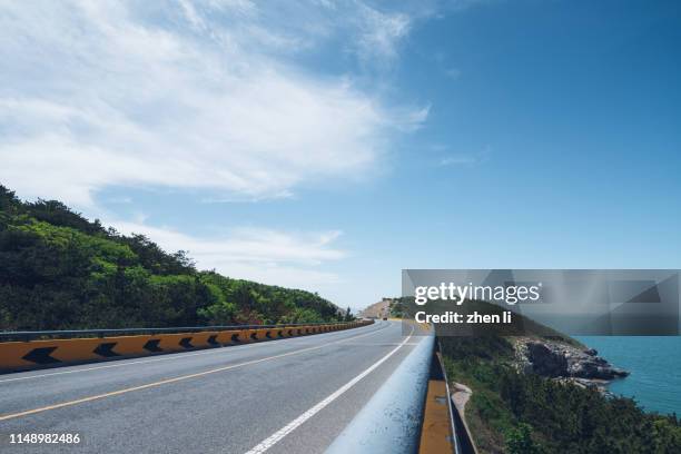 seaside highway - land boundary stock pictures, royalty-free photos & images