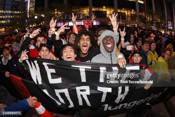 Fans cheer at Jurassic Park as they watch the Golden State Warriors play against the Toronto Raptors during Game Five of the 2019 NBA Finals at...