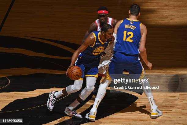 Kevin Durant of the Golden State Warriors dribbles the ball against the Toronto Raptors during Game Five of the NBA Finals on June 10, 2019 at...