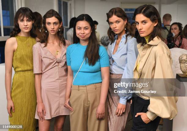 Anna Quan poses with models in the presentation space during the ANNA QUAN show at Mercedes-Benz Fashion Week Resort 20 Collections at Carol Crawford...