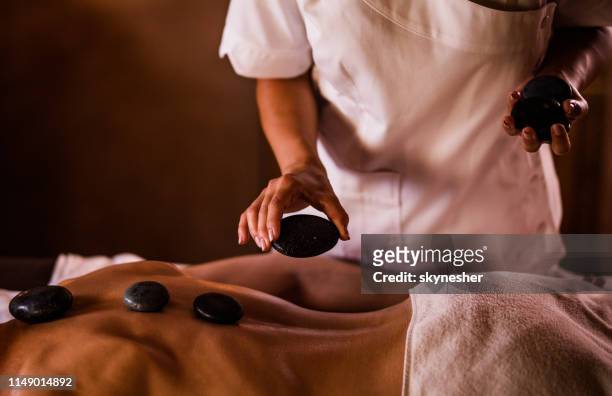lastone therapy at the spa! - lastone therapy stock pictures, royalty-free photos & images