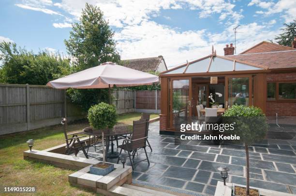 property exteriors - garden umbrella stock pictures, royalty-free photos & images