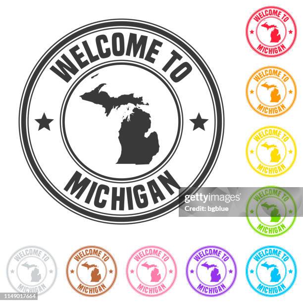welcome to michigan stamp - colorful badges on white background - detroit michigan stock illustrations