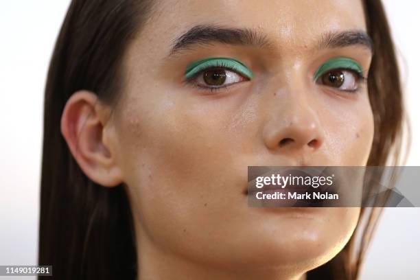 Model prepares backstage ahead of the Christopher Esber show at Mercedes-Benz Fashion Week Resort 20 Collections at Cement Fondu on May 14, 2019 in...