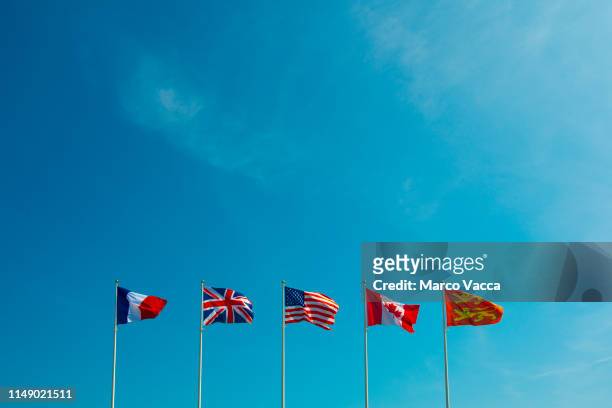 french, english, american, canadian and normandy flags - calvados stock pictures, royalty-free photos & images