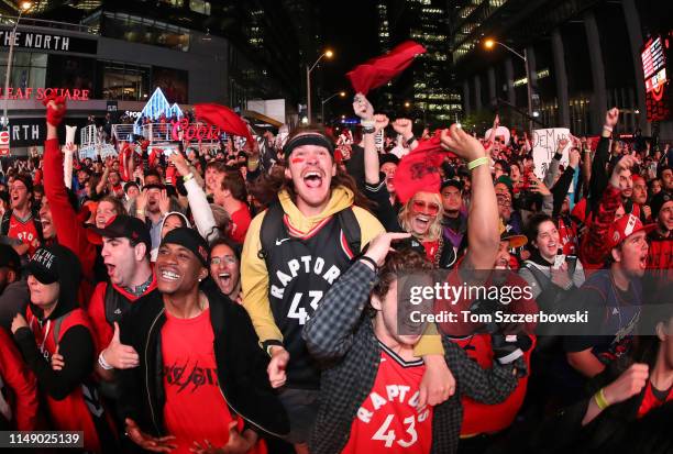 Fans watch in the fourth quarter as they gather at Jurassic Park to watch the Golden State Warriors play against the Toronto Raptors during Game Five...