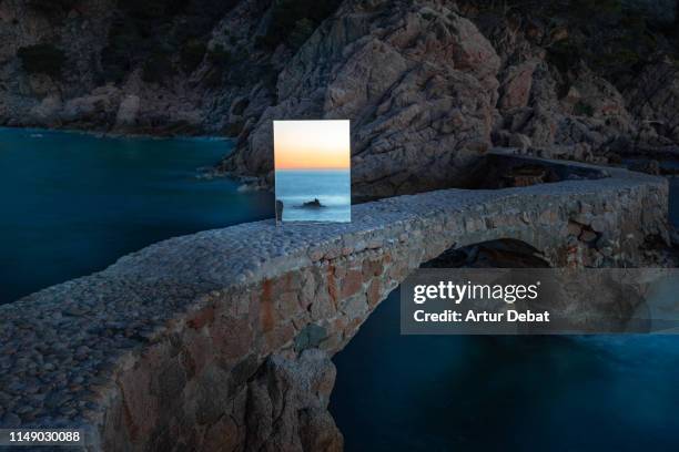 poetical picture of the sunrise seen through a mirror in the mediterranean sea coastline. - pathways concept stock pictures, royalty-free photos & images