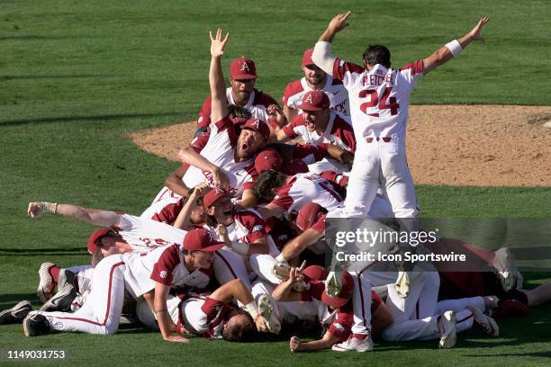 The Arkansas Razorbacks team celebrates after winning the Fayetteville Super Regional and qualifying for the College World Series after Game 3 of the...