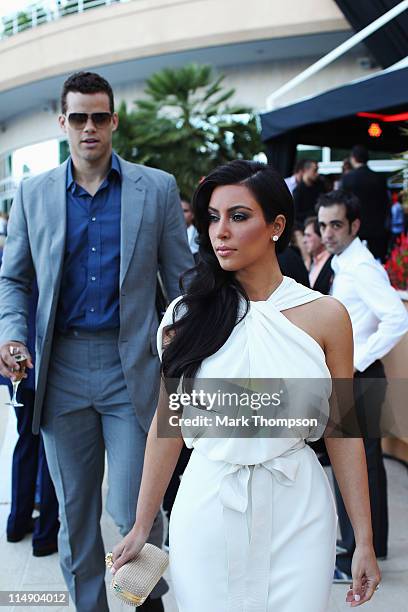 Kim Kardashian and Kris Humphries attend the Amber Fashion Show held at the Meridien Beach Plaza on May 27, 2011 in Monte Carlo, Monaco.