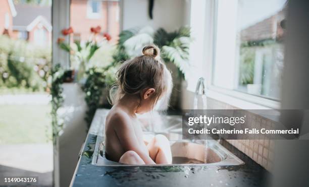 sink bath - washing curly hair stock pictures, royalty-free photos & images