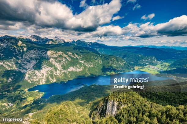 panoramic view of lake bohinj - slovenia lake stock pictures, royalty-free photos & images