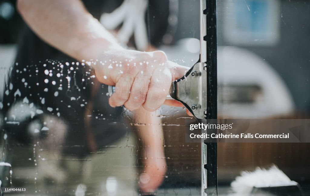 Man washing Window