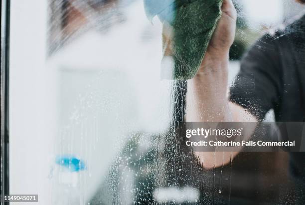 man washing window - rag stock pictures, royalty-free photos & images