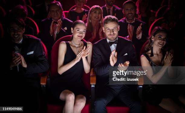 mature couple clapping while watching opera - men's formalwear stock pictures, royalty-free photos & images