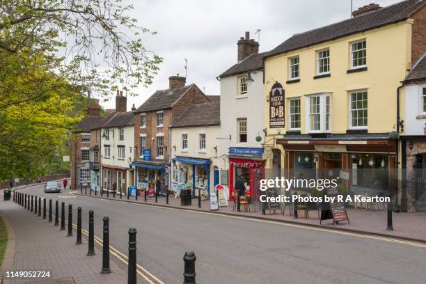 shops on the main street at ironbridge, shropshire, england - telford town centre foto e immagini stock