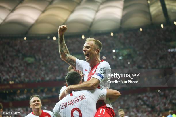Poland's forward Robert Lewandowski celebrate with temmate Kamil Grosicki after scoring during the UEFA Euro 2020 qualifier Group G football match...