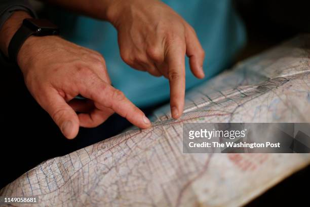 Rocco DePrimo, right, and Ryan Clay, left, look over a map from their time in Afghanistan at a hotel in Statesville, NC, Thursday, February 7, 2019....