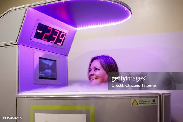 Amy Bateson stands in a Cryotherapy chamber while the temperature is lowered to negative 239 degrees Fahrenheit at the Andersonville cryotherapy and...