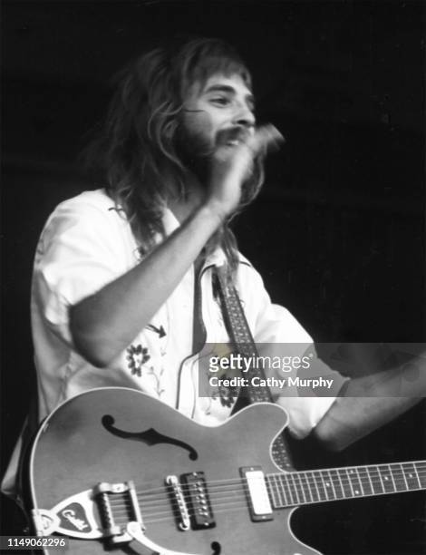American Pop, Rock, and Folk musician Kenny Loggins plays guitar as he performs on stage with his group, Loggins and Messina, Monterey, California,...