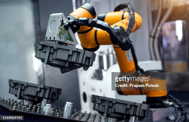 industrial machine and factory robot arm - smart stock pictures, royalty-free photos & images