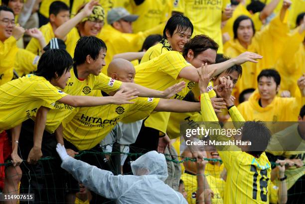 Junya Tanaka of Kashiwa Reysol celebrates with fans after scoring his team's second goal during the J.League match between Kashiwa Reysol and Vissel...