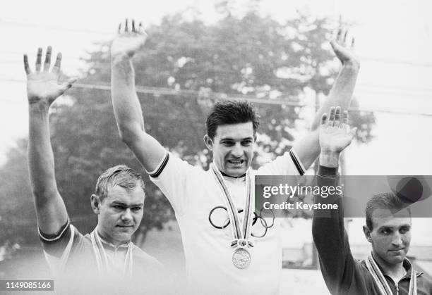 Mario Zanin of Italy celebrates his gold medal with second placed silver medallist Kjell Rodian of Denmark and third placed bronze medallist Walter...