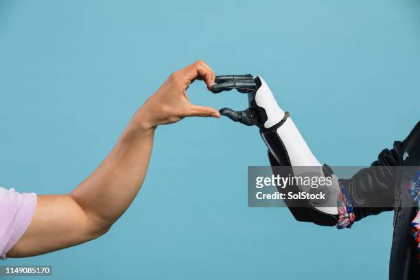human connection - robot hand human hand stock pictures, royalty-free photos & images