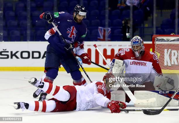 Robert Farmer of Great Britain challenges Oliver Lauridsen of Denmark during the 2019 IIHF Ice Hockey World Championship Slovakia group A game...