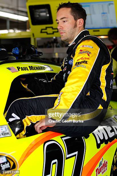 Paul Menard, driver of the Moen/Menards Chevrolet, climbs into his car prior to practice for the NASCAR Sprint Cup Series Coca-Cola 600 at Charlotte...