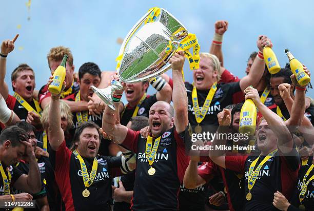 Saracens captain Steve Borthwick lifts the trophy after the AVIVA Premiership Final between Leicester Tigers and Saracens at Twickenham Stadium on...