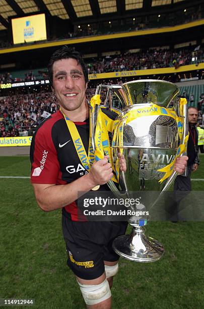 Kelly Brown of Saracens celebrates with the Aviva Premiership trophyduring the AVIVA Premiership Final between Leicester Tigers and Saracens at...